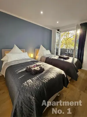 Ein Bett oder Betten in einem Zimmer der Unterkunft Modern Homes - Voll ausgestatte Wohnung - Balkon - Hotelbetten - 4K TV - WLAN