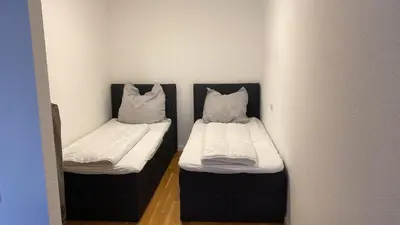 Ein Bett oder Betten in einem Zimmer der Unterkunft Barrierefreie Wohnung im Herzen der Stadt mit Parkplatz, Wifi und TV - Emma