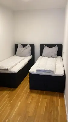 Ein Bett oder Betten in einem Zimmer der Unterkunft Barrierefreie Wohnung im Herzen der Stadt mit Parkplatz, Wifi und TV - Emma