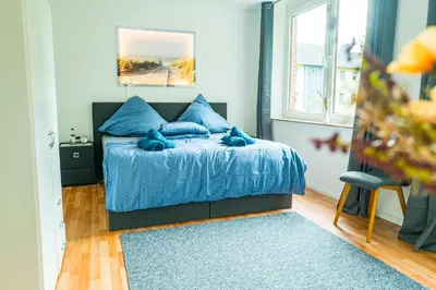 Ein Bett oder Betten in einem Zimmer der Unterkunft M-14 Komfortable Wohnung 10 Min bis Moviepark