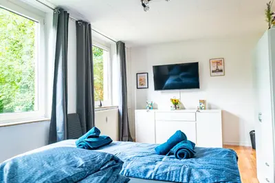 Ein Bett oder Betten in einem Zimmer der Unterkunft M-14 Komfortable Wohnung 10 Min bis Moviepark