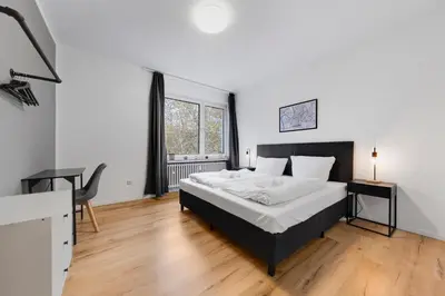 Ein Bett oder Betten in einem Zimmer der Unterkunft Apartment Düsseldorf 100QM, 6 Personen, Balkon, Messe, Küche