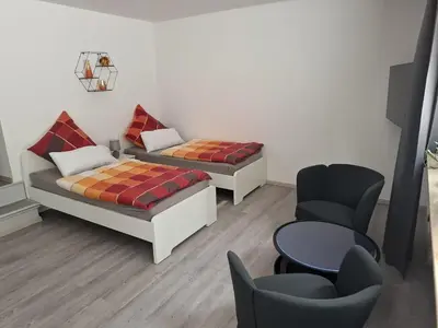 Ein Bett oder Betten in einem Zimmer der Unterkunft Ferienwohnung Unterrath
