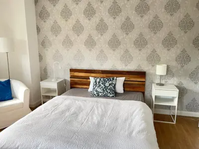 Ein Bett oder Betten in einem Zimmer der Unterkunft Gästeappartement Ratingen-Hösel