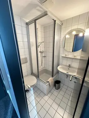 Ein Badezimmer in der Unterkunft M&M Park Hotel