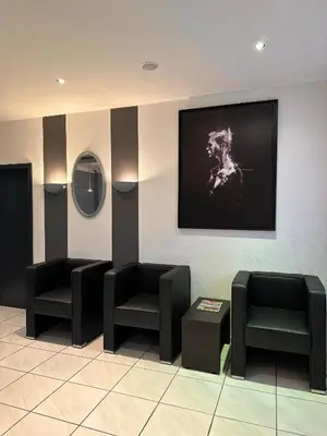 Ein Sitzbereich in der Unterkunft M&M Park Hotel