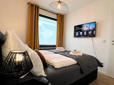 Ein Bett oder Betten in einem Zimmer der Unterkunft Apartment Ratingen - Balkon, Nähe DÜ-Messe und Airport