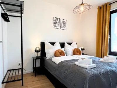 Ein Bett oder Betten in einem Zimmer der Unterkunft Apartment Ratingen - Balkon, Nähe DÜ-Messe und Airport