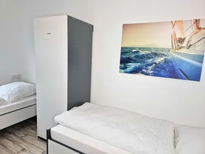 Ein Bett oder Betten in einem Zimmer der Unterkunft Meribu W18-20 Wohnung für Monteure und Arbeiter