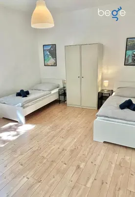 Ein Bett oder Betten in einem Zimmer der Unterkunft BEGE APARTMENTS WorkStay Lodge
