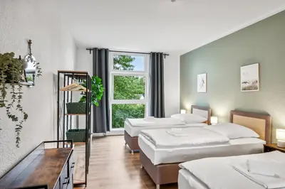 Ein Bett oder Betten in einem Zimmer der Unterkunft Sali Homes Apartmenthaus Bochum