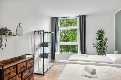 Ein Bett oder Betten in einem Zimmer der Unterkunft Sali Homes Apartmenthaus Bochum
