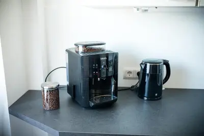 Kaffee-/Teezubehör in der Unterkunft Terrassenwohnung mit Gartenblick