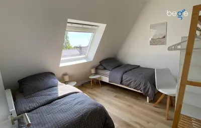 Ein Bett oder Betten in einem Zimmer der Unterkunft BEGE APARTMENTS Company Retreat