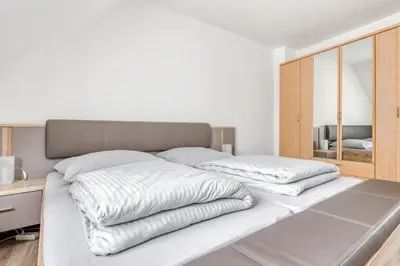 Ein Bett oder Betten in einem Zimmer der Unterkunft Ferienwohnung Gutmensch