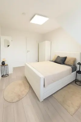 Ein Bett oder Betten in einem Zimmer der Unterkunft Sonnenglanz Wohnung auf der Vierten