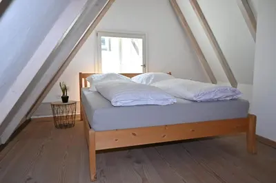 Ein Bett oder Betten in einem Zimmer der Unterkunft Gemütliches Fachwerkhaus