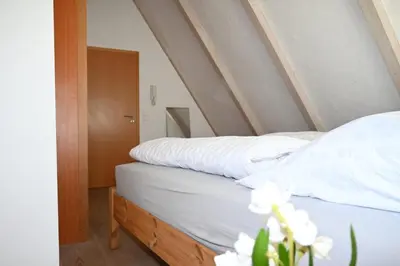 Ein Bett oder Betten in einem Zimmer der Unterkunft Gemütliches Fachwerkhaus