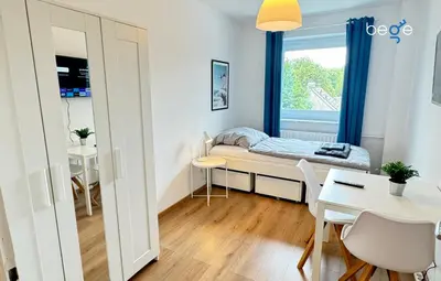 Ein Bett oder Betten in einem Zimmer der Unterkunft BEGE APARTMENTS Corporate Hub