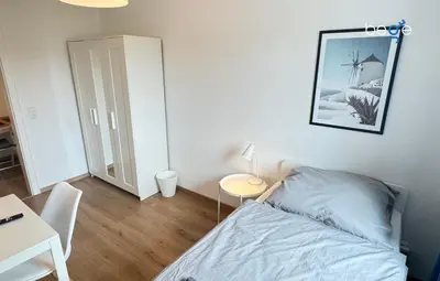 Ein Bett oder Betten in einem Zimmer der Unterkunft BEGE APARTMENTS Corporate Hub