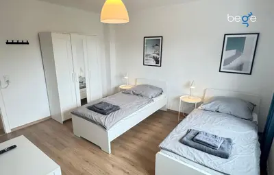 Ein Bett oder Betten in einem Zimmer der Unterkunft BEGE APARTMENTS Corporate Hub