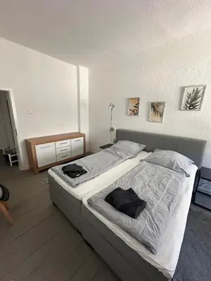 Ein Bett oder Betten in einem Zimmer der Unterkunft After-Work-Home 1