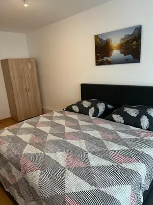 Ein Bett oder Betten in einem Zimmer der Unterkunft Holiday-Ferienwohnung Solingen-Mitte