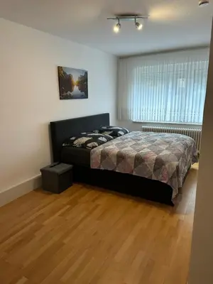 Ein Bett oder Betten in einem Zimmer der Unterkunft Holiday-Ferienwohnung Solingen-Mitte