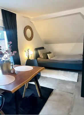 Ein Bett oder Betten in einem Zimmer der Unterkunft Stilvolles Apartment nähe Messe Düsseldorf in Duisburg Süd