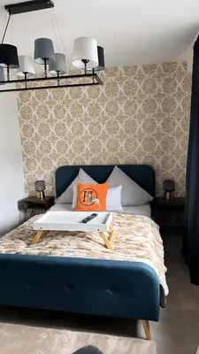 Ein Bett oder Betten in einem Zimmer der Unterkunft Stilvolles Apartment nähe Messe Düsseldorf in Duisburg Süd