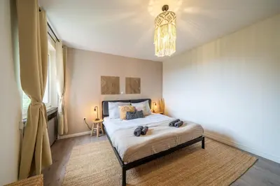 Ein Bett oder Betten in einem Zimmer der Unterkunft SuperSuite2 BohoApartment Balkon