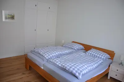 Ein Bett oder Betten in einem Zimmer der Unterkunft Ferienwohnung Haus am Fluß