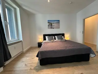 Ein Bett oder Betten in einem Zimmer der Unterkunft 20-traumhaftes-modernes Loft über 2 Etagen in bester Lage von W-Elberfeld-Super Ausstattung