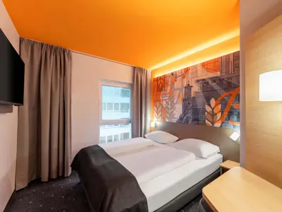 Ein Bett oder Betten in einem Zimmer der Unterkunft B&B HOTEL Hagen