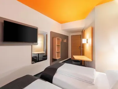 Ein Bett oder Betten in einem Zimmer der Unterkunft B&B HOTEL Hagen