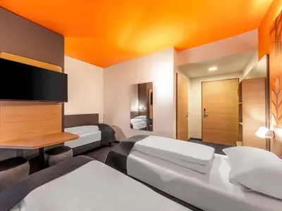 Ein Bett oder Betten in einem Zimmer der Unterkunft B&B HOTEL Hagen