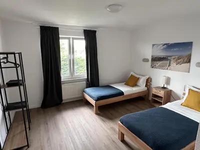 Ein Bett oder Betten in einem Zimmer der Unterkunft Aparthotel 9 min to Dus Airport & 17 min to DUS Messe
