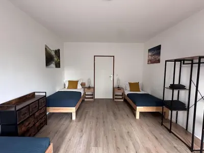 Ein Bett oder Betten in einem Zimmer der Unterkunft Aparthotel 9 min to Dus Airport & 17 min to DUS Messe
