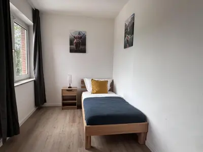 Ein Bett oder Betten in einem Zimmer der Unterkunft Aparthotel 9 min to Dus Airport & 17 min to DUS Messe
