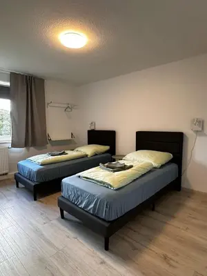 Ein Bett oder Betten in einem Zimmer der Unterkunft ELENA flat Maiglöckchen CentrO Westfield Centro