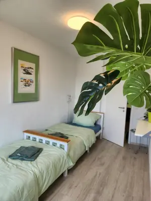 Ein Bett oder Betten in einem Zimmer der Unterkunft ELENA flat Maiglöckchen CentrO Westfield Centro