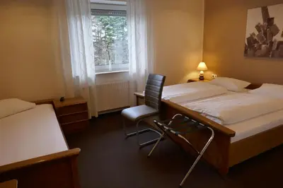 Ein Bett oder Betten in einem Zimmer der Unterkunft Hotel van Lendt garni