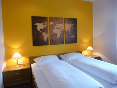 Ein Bett oder Betten in einem Zimmer der Unterkunft Hotel van Lendt garni