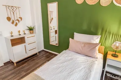 Ein Bett oder Betten in einem Zimmer der Unterkunft Imposante Whg - Zentral - Dachterrasse - Parken - Aufzug