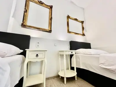 Ein Bett oder Betten in einem Zimmer der Unterkunft Paris Suite für 4 mit Küche und WIFI
