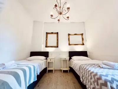 Ein Bett oder Betten in einem Zimmer der Unterkunft Paris Suite für 4 mit Küche und WIFI