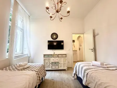Ein Bett oder Betten in einem Zimmer der Unterkunft Paris Suite für 4 mit Küche und WIFI