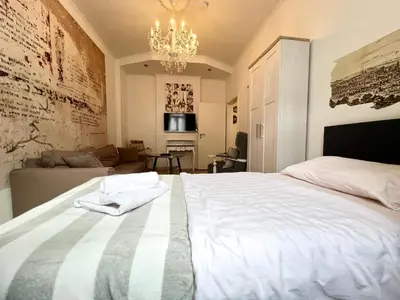 Ein Bett oder Betten in einem Zimmer der Unterkunft Paris Suite für 4 mit Küche und WIFI