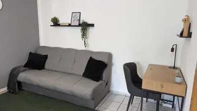 Ein Sitzbereich in der Unterkunft Gemütliche Wohnung mit Parkplatz