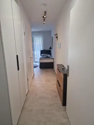 Ein Bett oder Betten in einem Zimmer der Unterkunft Parkside Modernes Studio Appartment